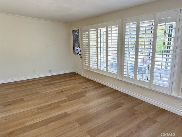 29041 Desert Hills Rd, Menifee, CA 92586 - spare room featuring wood finished floors and healthy amount of natural light