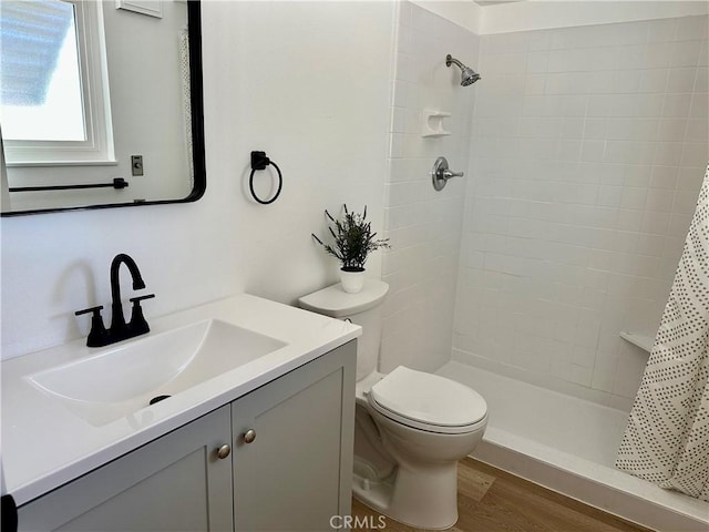 29041 Desert Hills Rd, Menifee, CA 92586 - full bath featuring vanity, a tile shower, and wood finished floors
