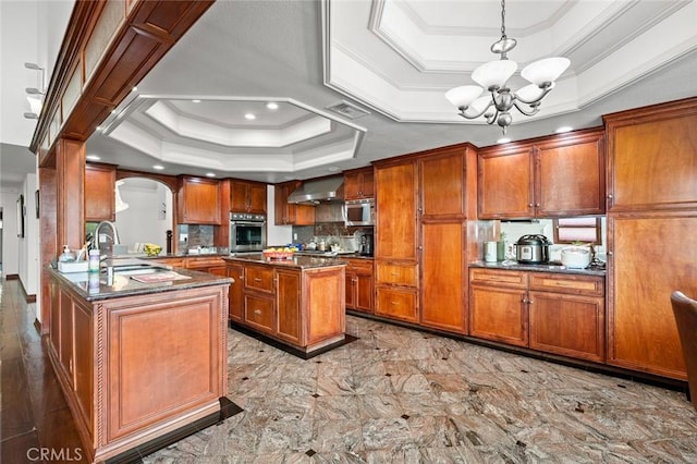 22410 Starwood Dr, Yorba Linda, CA 92887 - kitchen with stainless steel appliances, a raised ceiling, a chandelier, brown cabinets, and crown molding