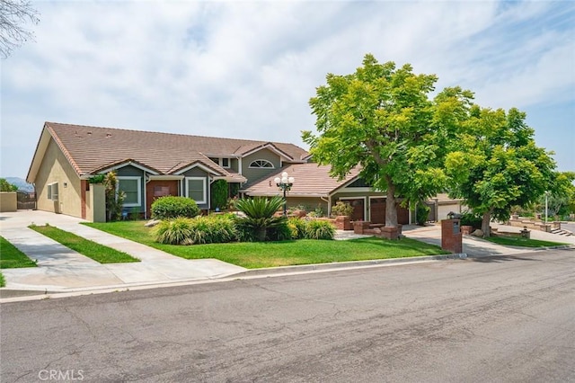 22410 Starwood Dr, Yorba Linda, CA 92887 - view of front of property with driveway, a front lawn, a tile roof, and stucco siding