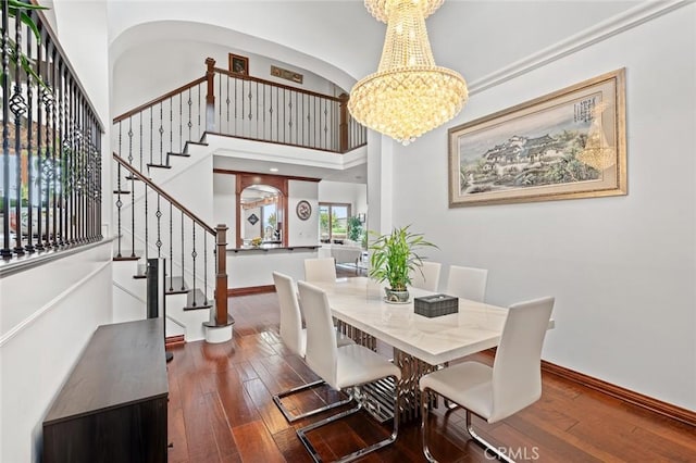 22410 Starwood Dr, Yorba Linda, CA 92887 - dining area featuring stairway, wood-type flooring, a chandelier, and a towering ceiling