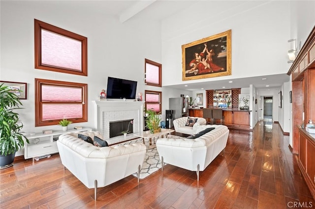 22410 Starwood Dr, Yorba Linda, CA 92887 - living room with a high ceiling, a brick fireplace, and dark wood-style floors