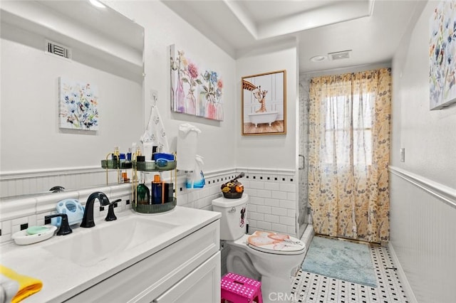 22410 Starwood Dr, Yorba Linda, CA 92887 - bathroom featuring a wainscoted wall, a stall shower, tile patterned flooring, vanity, and tile walls