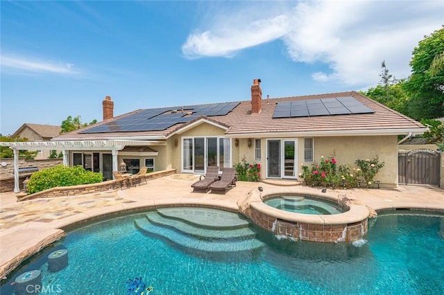 22410 Starwood Dr, Yorba Linda, CA 92887 - back of house featuring a chimney, stucco siding, and roof mounted solar panels
