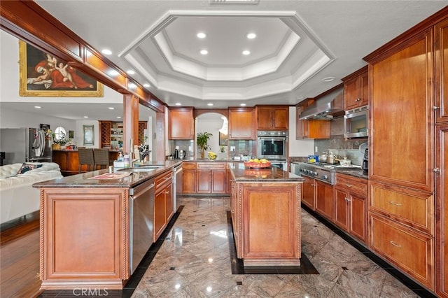 22410 Starwood Dr, Yorba Linda, CA 92887 - kitchen featuring wall chimney exhaust hood, stainless steel appliances, a center island, open floor plan, and tasteful backsplash