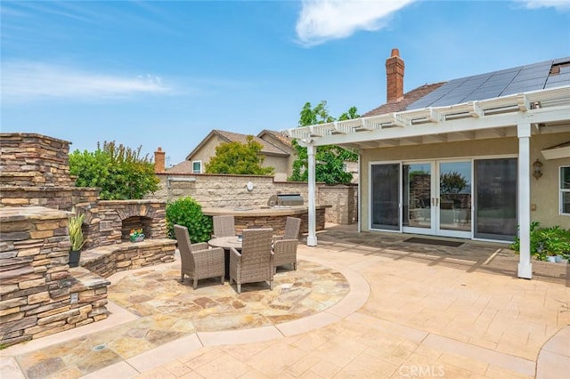 22410 Starwood Dr, Yorba Linda, CA 92887 - view of patio with french doors, outdoor dining space, a pergola, exterior kitchen, and an outdoor stone fireplace