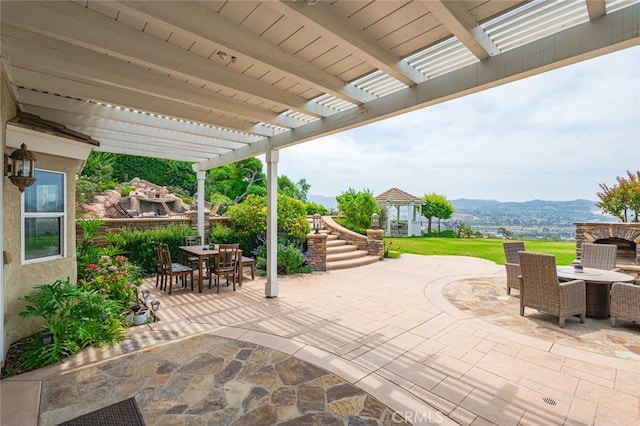 22410 Starwood Dr, Yorba Linda, CA 92887 - view of patio / terrace with outdoor dining space, a pergola, and a mountain view