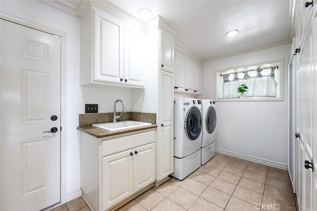 22410 Starwood Dr, Yorba Linda, CA 92887 - laundry room with washing machine and clothes dryer, cabinet space, light tile patterned floors, and ornamental molding