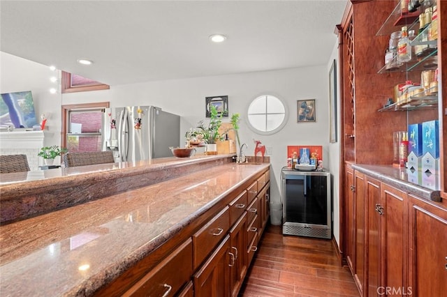22410 Starwood Dr, Yorba Linda, CA 92887 - kitchen featuring stainless steel fridge with ice dispenser, dark wood-style flooring, stone countertops, recessed lighting, and a fireplace