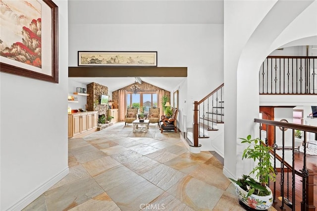 22410 Starwood Dr, Yorba Linda, CA 92887 - entrance foyer featuring stone tile floors, a towering ceiling, stairs, a chandelier, and arched walkways