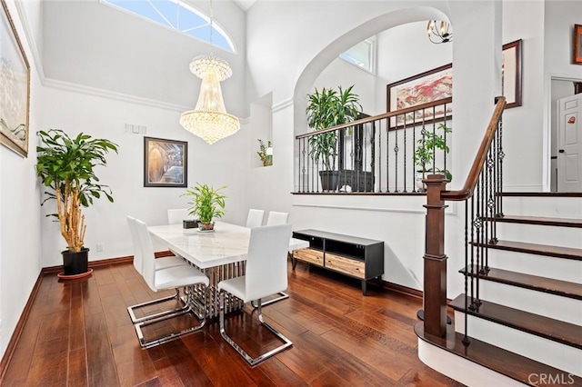 22410 Starwood Dr, Yorba Linda, CA 92887 - dining area featuring a chandelier, a high ceiling, stairway, and hardwood / wood-style floors