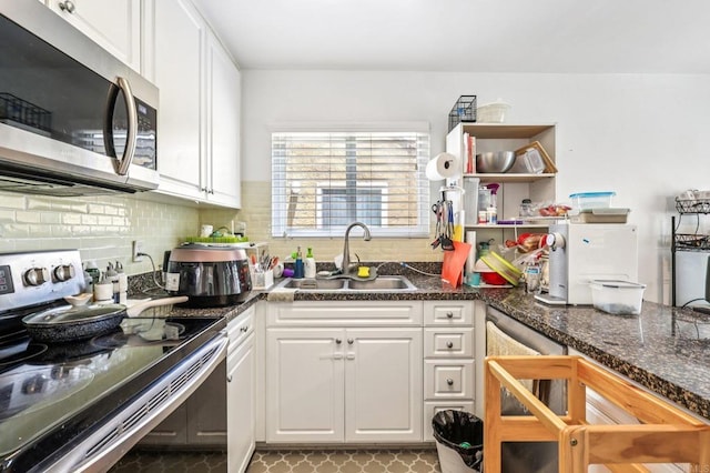 17181 W Bernardo Dr Unit 208, San Diego, CA 92127 - kitchen featuring appliances with stainless steel finishes, white cabinets, tasteful backsplash, open shelves, and dark stone countertops