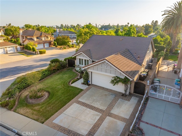 6001 Via De Mansion, La Verne, CA 91750 - view of front of property with a gate, a tiled roof, concrete driveway, a residential view, and a garage
