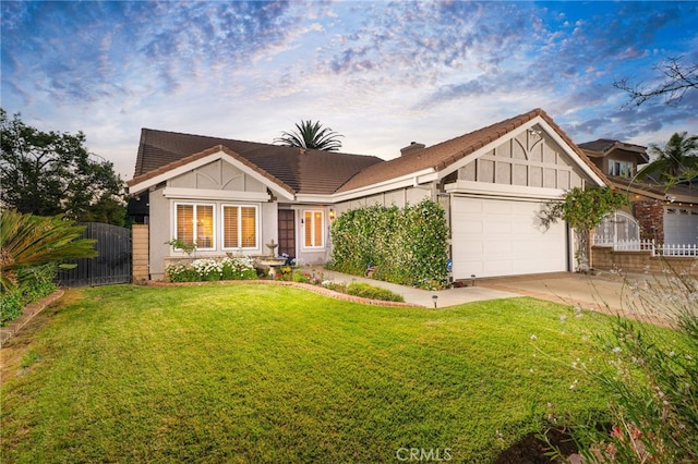 6001 Via De Mansion, La Verne, CA 91750 - tudor home featuring a garage, driveway, and stucco siding