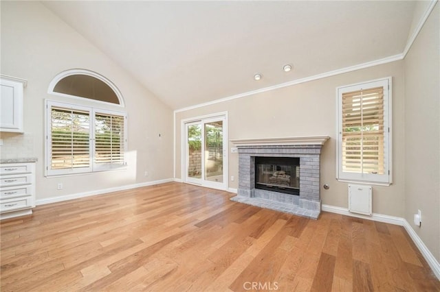 6001 Via De Mansion, La Verne, CA 91750 - unfurnished living room with a fireplace, light wood-style floors, high vaulted ceiling, and crown molding