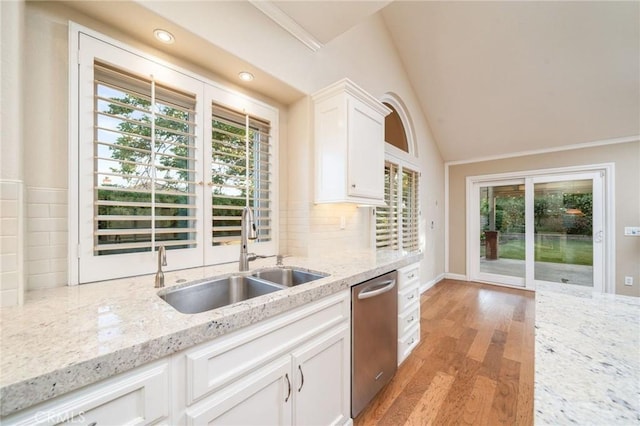 6001 Via De Mansion, La Verne, CA 91750 - kitchen with dishwasher, plenty of natural light, white cabinets, light wood finished floors, and lofted ceiling