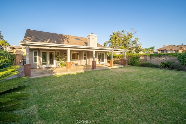 6001 Via De Mansion, La Verne, CA 91750 - back of property featuring french doors, a chimney, and a patio