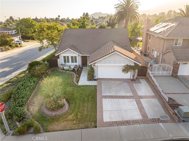 6001 Via De Mansion, La Verne, CA 91750 - view of front of property featuring concrete driveway, a gate, a tiled roof, and an attached garage