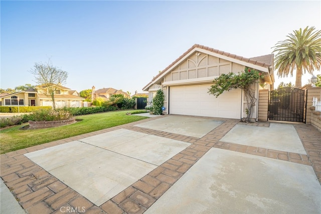 6001 Via De Mansion, La Verne, CA 91750 - view of front of house with a front yard, driveway, a garage, a gate, and stucco siding