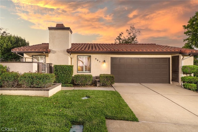 865 Via Maria, Upland, CA 91784 - mediterranean / spanish home with an attached garage, concrete driveway, a tiled roof, stucco siding, and a chimney