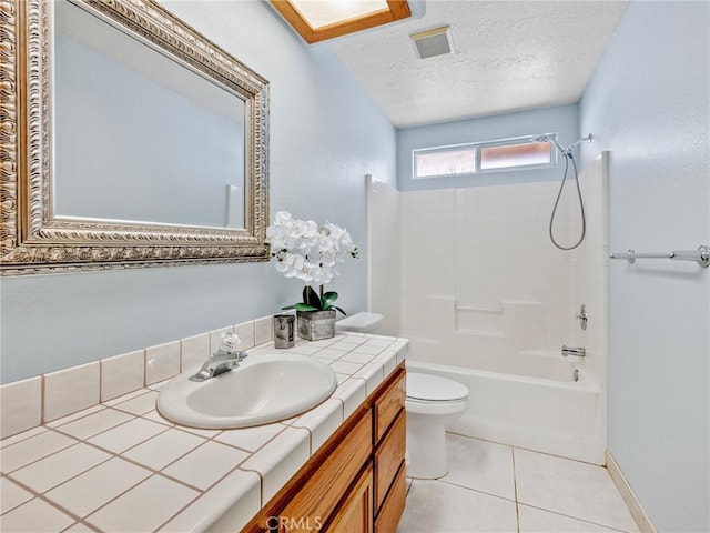 7556 Glider Ave, Hesperia, CA 92345 - full bathroom featuring vanity, tub / shower combination, a textured ceiling, and tile patterned floors