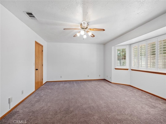 7556 Glider Ave, Hesperia, CA 92345 - unfurnished room with a ceiling fan, carpet floors, and a textured ceiling