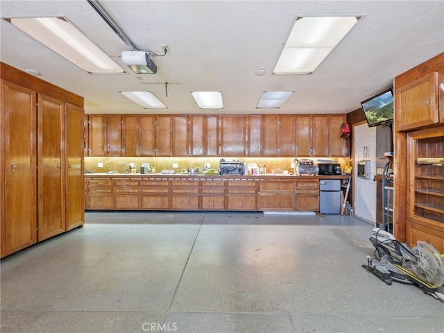 7556 Glider Ave, Hesperia, CA 92345 - garage with refrigerator and a garage door opener