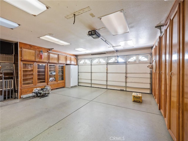 7556 Glider Ave, Hesperia, CA 92345 - garage with freestanding refrigerator and a garage door opener