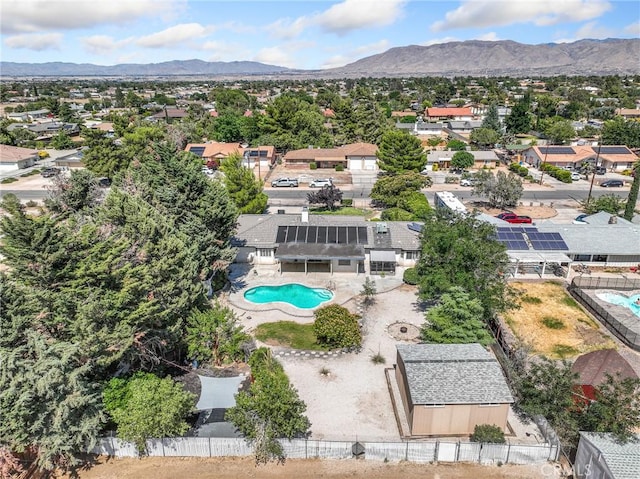 7556 Glider Ave, Hesperia, CA 92345 - aerial perspective of suburban area with a pool area and mountains