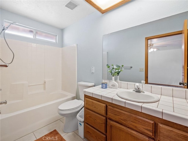 7556 Glider Ave, Hesperia, CA 92345 - full bathroom with vanity, tile patterned floors, washtub / shower combination, and ceiling fan