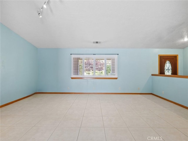 7556 Glider Ave, Hesperia, CA 92345 - bonus room featuring a textured ceiling and light tile patterned floors