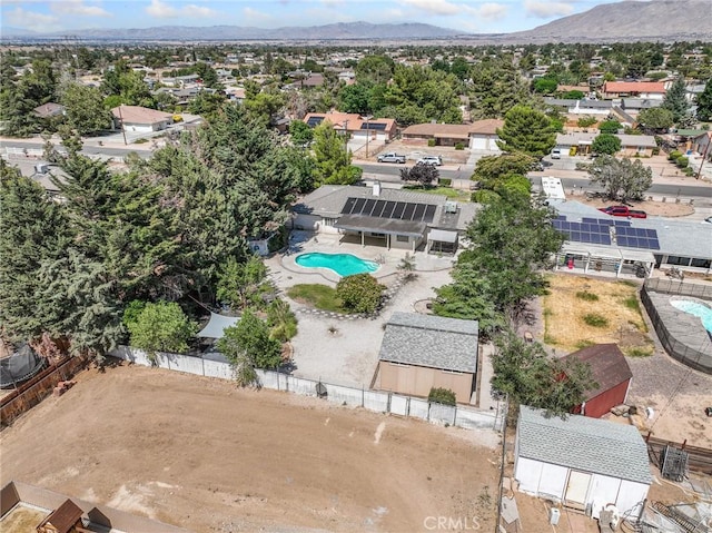 7556 Glider Ave, Hesperia, CA 92345 - aerial perspective of suburban area featuring a mountainous background and a pool