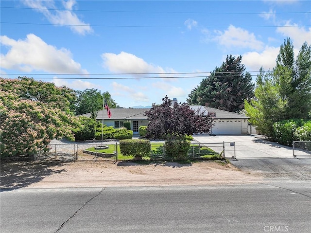 7556 Glider Ave, Hesperia, CA 92345 - obstructed view of property with a fenced front yard and driveway