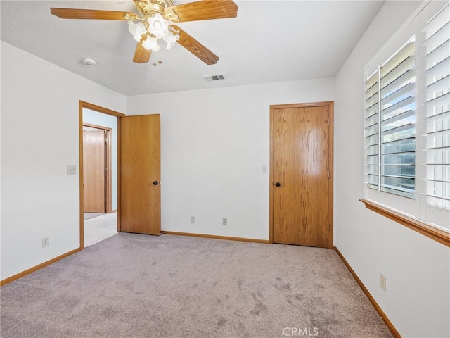 7556 Glider Ave, Hesperia, CA 92345 - unfurnished bedroom featuring carpet flooring and ceiling fan