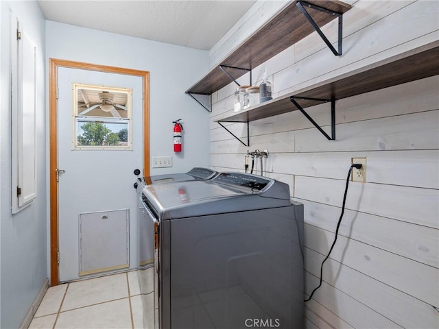 7556 Glider Ave, Hesperia, CA 92345 - laundry room featuring separate washer and dryer and light tile patterned floors