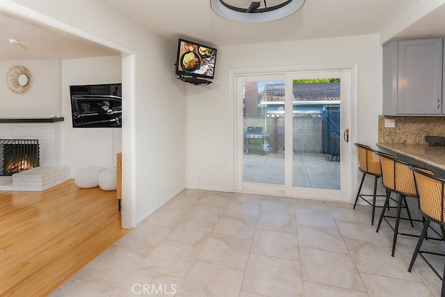 8398 Shoup Ave, West Hills, CA 91304 - unfurnished dining area with a brick fireplace