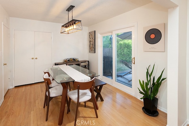 8398 Shoup Ave, West Hills, CA 91304 - dining space featuring light wood finished floors and a chandelier