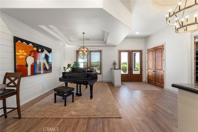 54774 Bautista Rd, Anza, CA 92539 - entryway with a chandelier, french doors, wood finished floors, a tray ceiling, and wooden walls
