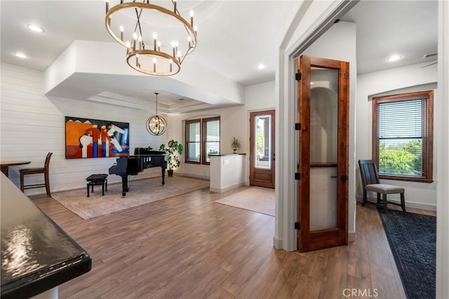 54774 Bautista Rd, Anza, CA 92539 - foyer featuring a chandelier, healthy amount of natural light, wood finished floors, recessed lighting, and wooden walls