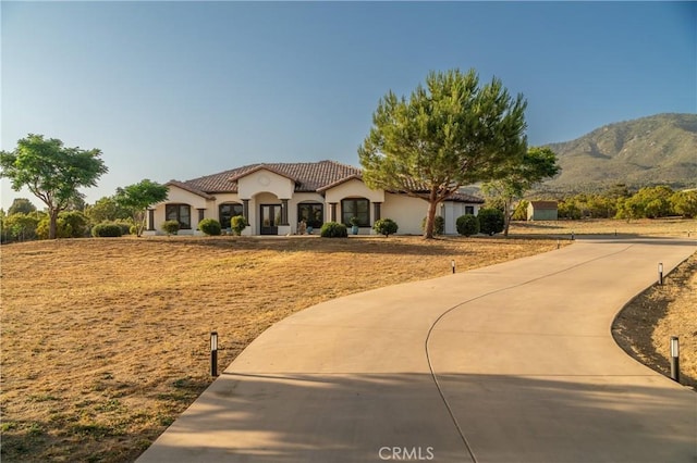54774 Bautista Rd, Anza, CA 92539 - mediterranean / spanish-style home featuring a tile roof, stucco siding, and a mountain view