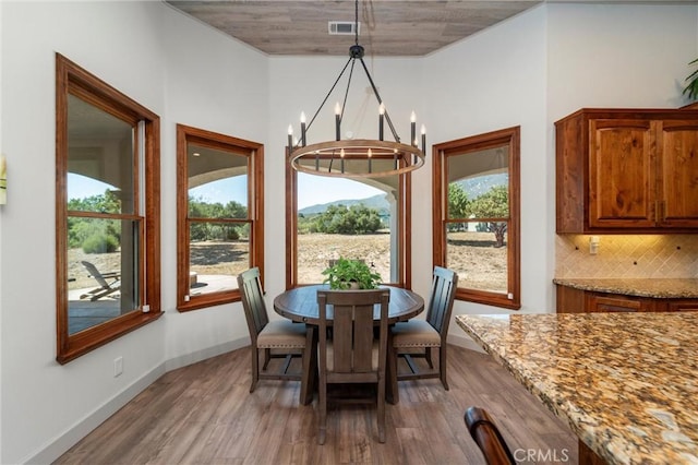54774 Bautista Rd, Anza, CA 92539 - dining area featuring wood finished floors and a chandelier
