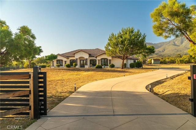 54774 Bautista Rd, Anza, CA 92539 - mediterranean / spanish-style home featuring a tiled roof, stucco siding, and a mountain view