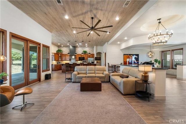 54774 Bautista Rd, Anza, CA 92539 - living area featuring french doors, wood finished floors, recessed lighting, wood ceiling, and a chandelier
