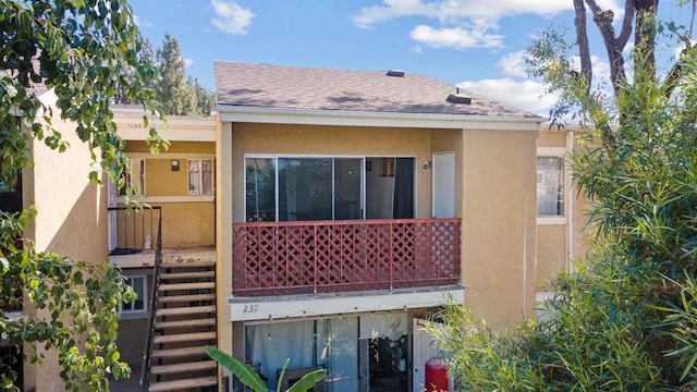 475 N Midway Dr Unit 230, Escondido, CA 92027 - back of house featuring stairway, stucco siding, and a shingled roof