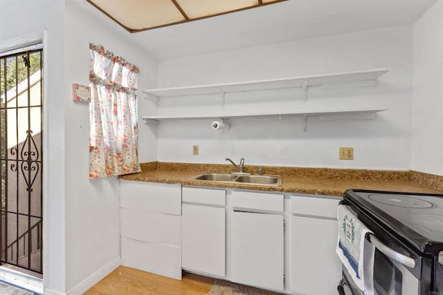 475 N Midway Dr Unit 230, Escondido, CA 92027 - kitchen featuring open shelves, white cabinetry, light wood-type flooring, and stainless steel electric range
