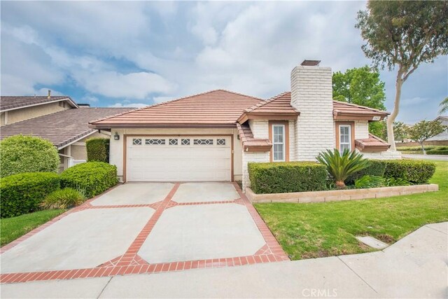747 De Jesus, Placentia, CA 92870 - single story home with a chimney, a garage, driveway, and a tiled roof