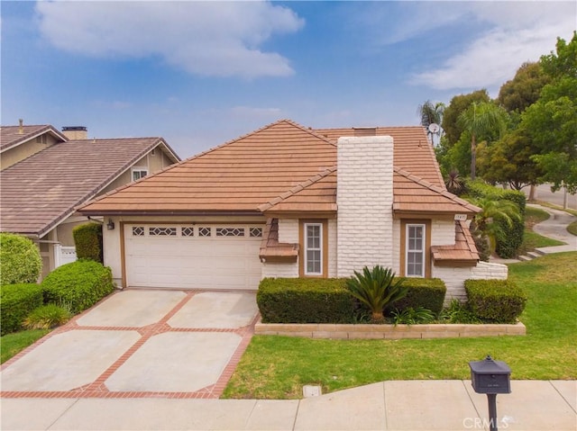 747 De Jesus, Placentia, CA 92870 - view of front of property with a garage, driveway, a chimney, and a tile roof