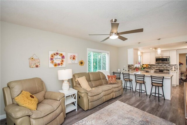 747 De Jesus, Placentia, CA 92870 - living area with dark wood-style floors, ceiling fan, and a textured ceiling