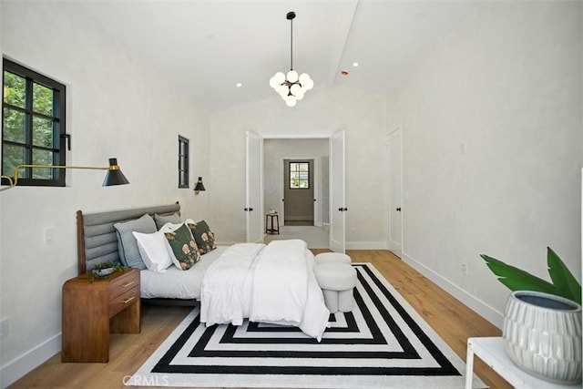 3756 Goodland Ave, Studio City, CA 91604 - bedroom featuring a chandelier and light wood-style floors