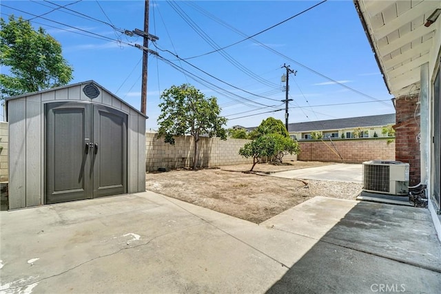 10422 Gilbert St, Anaheim, CA 92804 - fenced backyard with a patio area and a storage unit